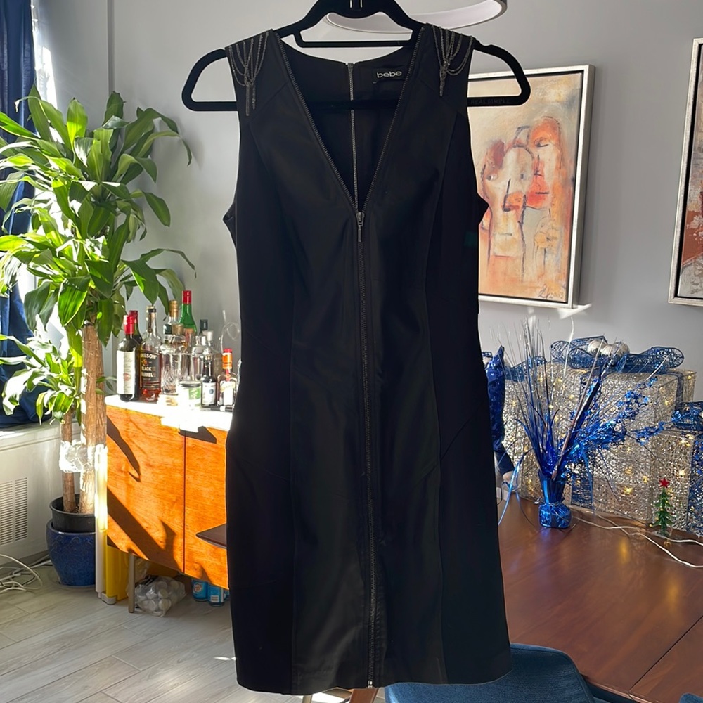 Bebe. Black front and back zip dress. Size S